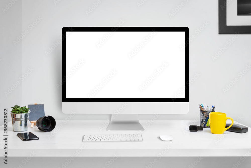 Poster Computer display mockup on office desk with isolated screen for web site design or product presentation