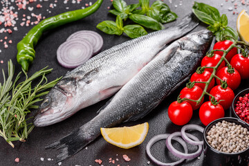 Fresh fish seabass and ingredients for cooking. Raw fish seabass