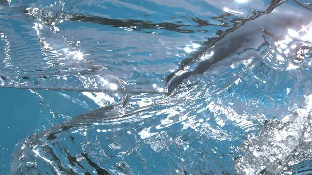 Pure Water Waves Splashing on Blue Background in Slow Motion 4k