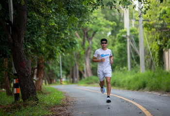 Asian men jogging and running in the park