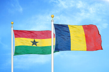 Ghana and Chad two flags on flagpoles and blue sky