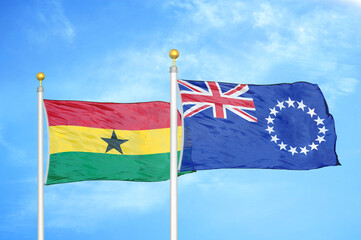 Ghana and Cook Islands two flags on flagpoles and blue sky