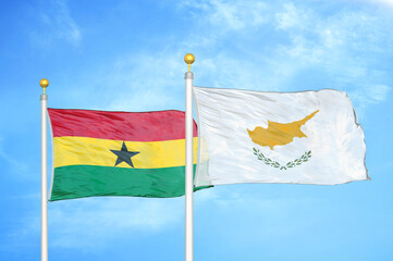 Ghana and Cyprus two flags on flagpoles and blue sky