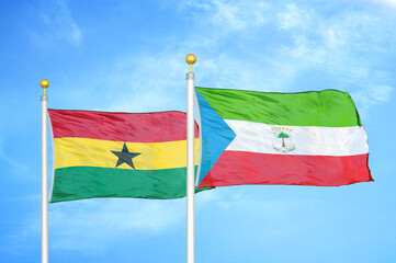 Ghana and Equatorial Guinea two flags on flagpoles and blue sky
