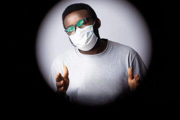 Young African man in medical face protection mask
