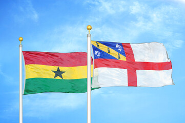 Ghana and Herm two flags on flagpoles and blue sky