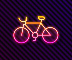Fototapeta premium Glowing neon line Bicycle icon isolated on black background. Bike race. Extreme sport. Sport equipment. Vector.