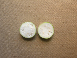 Cut halves of white color raw Tinda round squash