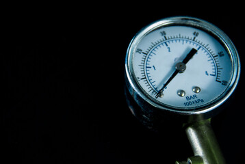 Blur image of tire pressure monitoring equipment, indicator hand, on a black background
