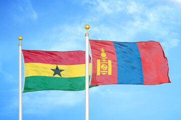 Ghana and Mongolia two flags on flagpoles and blue sky
