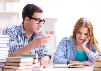 Pair of students studying for university exams