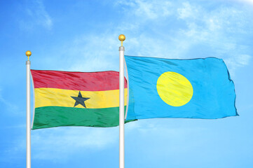 Ghana and Palau two flags on flagpoles and blue sky