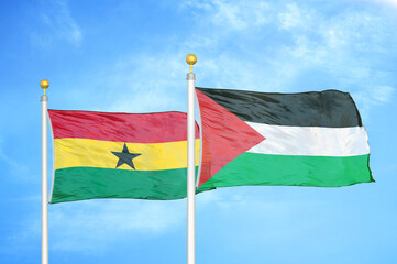 Ghana and Palestine two flags on flagpoles and blue sky
