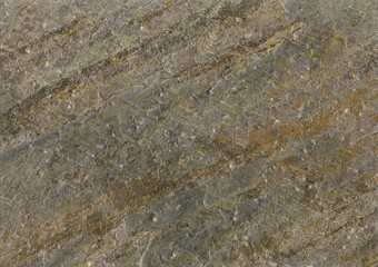Natural slate stone texture background with grey curly veins. Stone sample from India