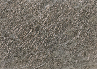 Pattern of seamless rock texture and surface background close-up. Stone sample from India