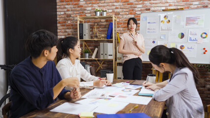 asian japanese business man and women people having discussion in modern office. Young female...