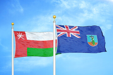 Oman and Montserrat two flags on flagpoles and blue sky