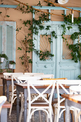 Fototapeta na wymiar Cozy terrace on a greek street.