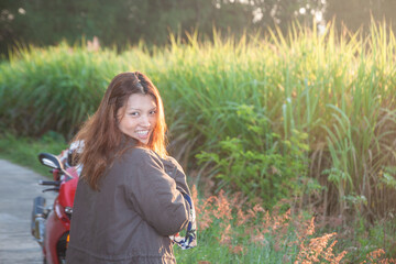 Solo Thai biker with sunset