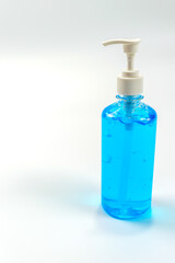 Alcohol gel bottles for hand washing. Disinfecting alcohol. Handwashing alcohol has a clear blue color on a white background.