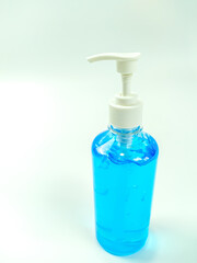 Alcohol gel bottles for hand washing. Disinfecting alcohol. Handwashing alcohol has a clear blue color on a white background.