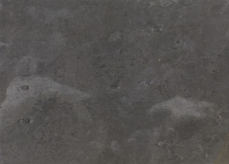 Black stone texture surface. Stone sample from India