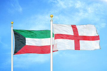 Kuwait and England two flags on flagpoles and blue sky