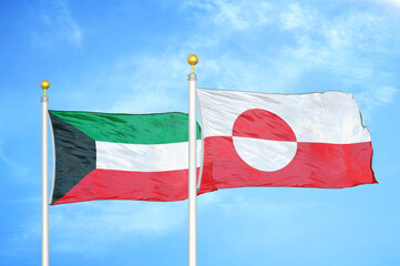 Fototapeta na wymiar Kuwait and Greenland two flags on flagpoles and blue sky