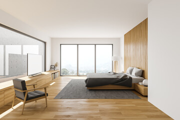 White and wooden bedroom with armchair