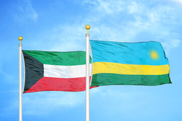 Kuwait and Rwanda two flags on flagpoles and blue sky