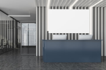 Grey reception desk and poster in wooden office