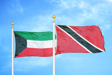 Kuwait and Trinidad and Tobago two flags on flagpoles and blue sky