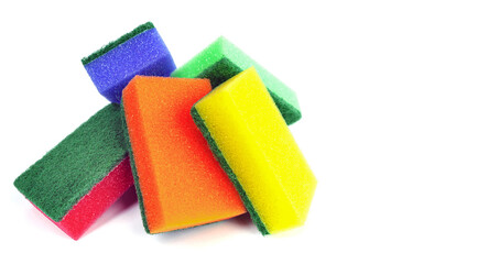colored sponges in a pile, highlighted on white
