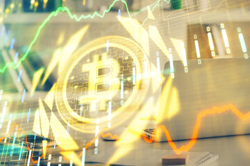 Multi exposure of blockchain theme hologram and table with computer background. Concept of bitcoin...