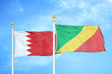 Bahrain and Congo two flags on flagpoles and blue sky