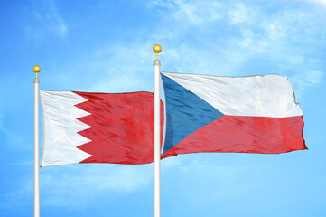 Fototapeta na wymiar Bahrain and Czech Republic two flags on flagpoles and blue sky