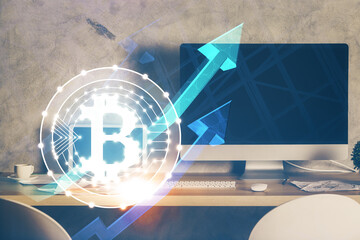 Multi exposure of blockchain theme hologram and table with computer background. Concept of bitcoin...