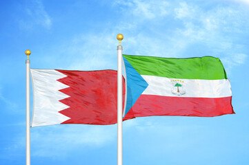 Bahrain and Equatorial Guinea two flags on flagpoles and blue sky