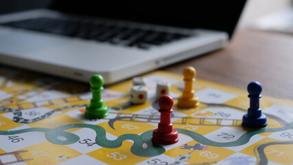 Close-up of snakes and ladders game children playground.