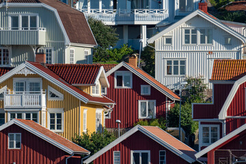 Swedish summerhouse and homes colorful facades and rooftops in archepelago of West coast Sweden,...
