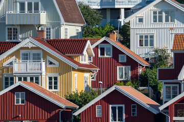 Swedish summerhouse and homes colorful facades and rooftops in archepelago of West coast Sweden, Bovallstrand by the Sea.
