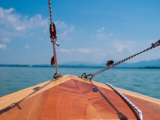 Wooden boat at lake Chiemsee, Bavaria, on a sunny summer day