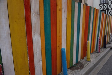 colorful wooden fence protecting a construction site in france