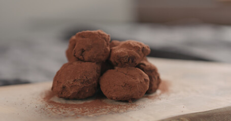 handmade chocolate truffles on a wood board