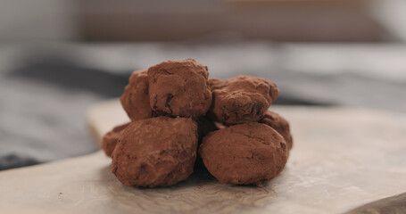 handmade chocolate truffles on a wood board