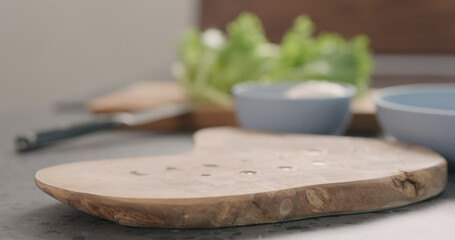 empty olive wood board on kitchen countertop