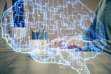 Man with computer background with brain theme hologram. Concept of brainstorm. Double exposure.