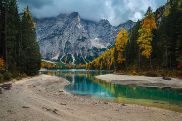 Clean lake and foggy mountains in the Dolomites, Italy
