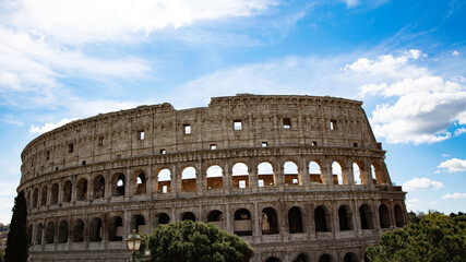 Naklejka premium Colosseum in Rome, Italy with blue sky which Ancient Roman Colosseum is one of main tourist attractions in Europe