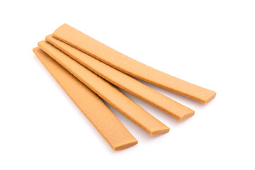 Brown meat stick for puppy isolated on white background